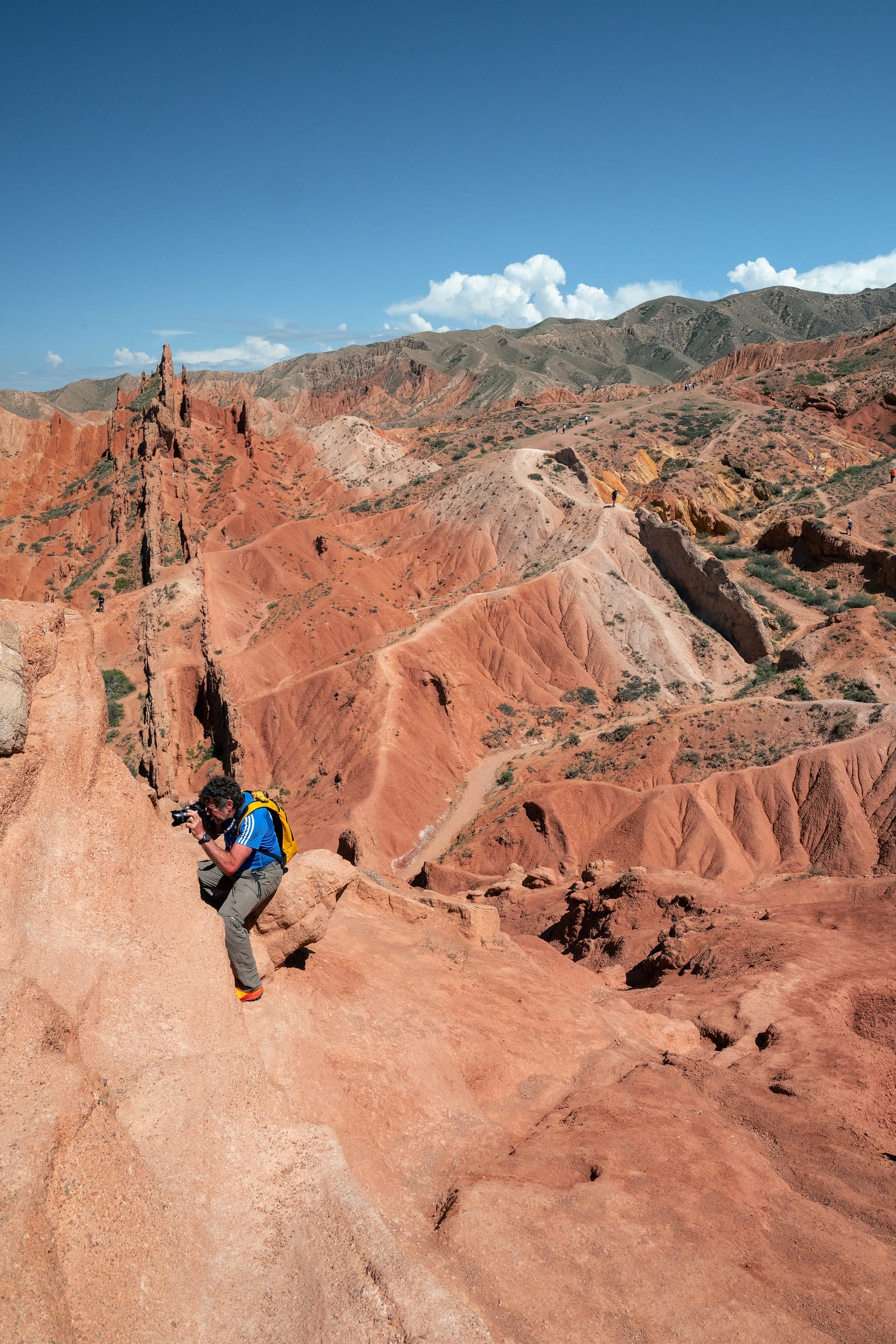 A man photographing from the red rock