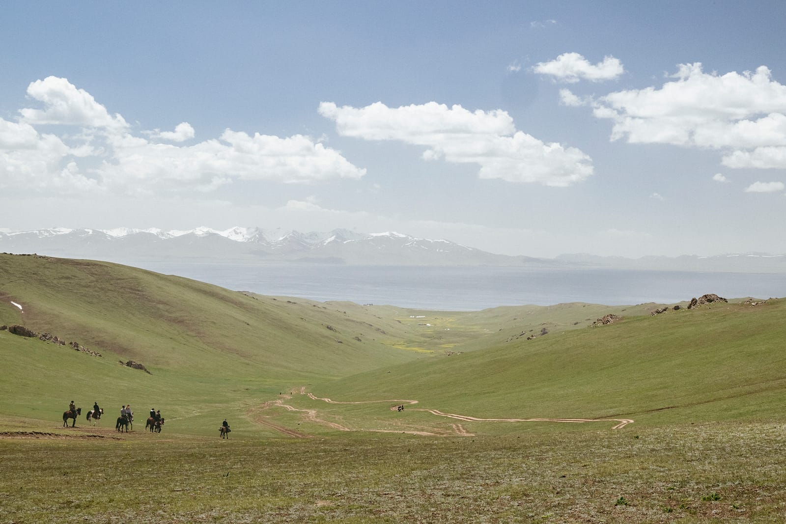 Green hills running down to the lake